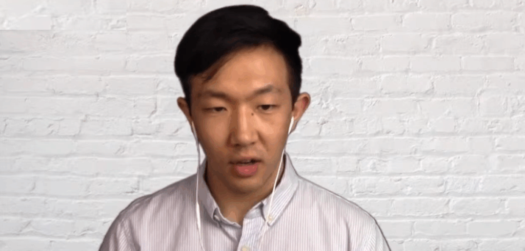 Analyst Dennis Liu giving an interview.